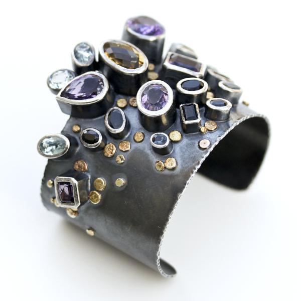 Handmade one of a kind bangle in oxidized sterling silver with Amethyst, Citrine, Topaz, Tourmaline, and Sapphire with 18K Gold dots, side view